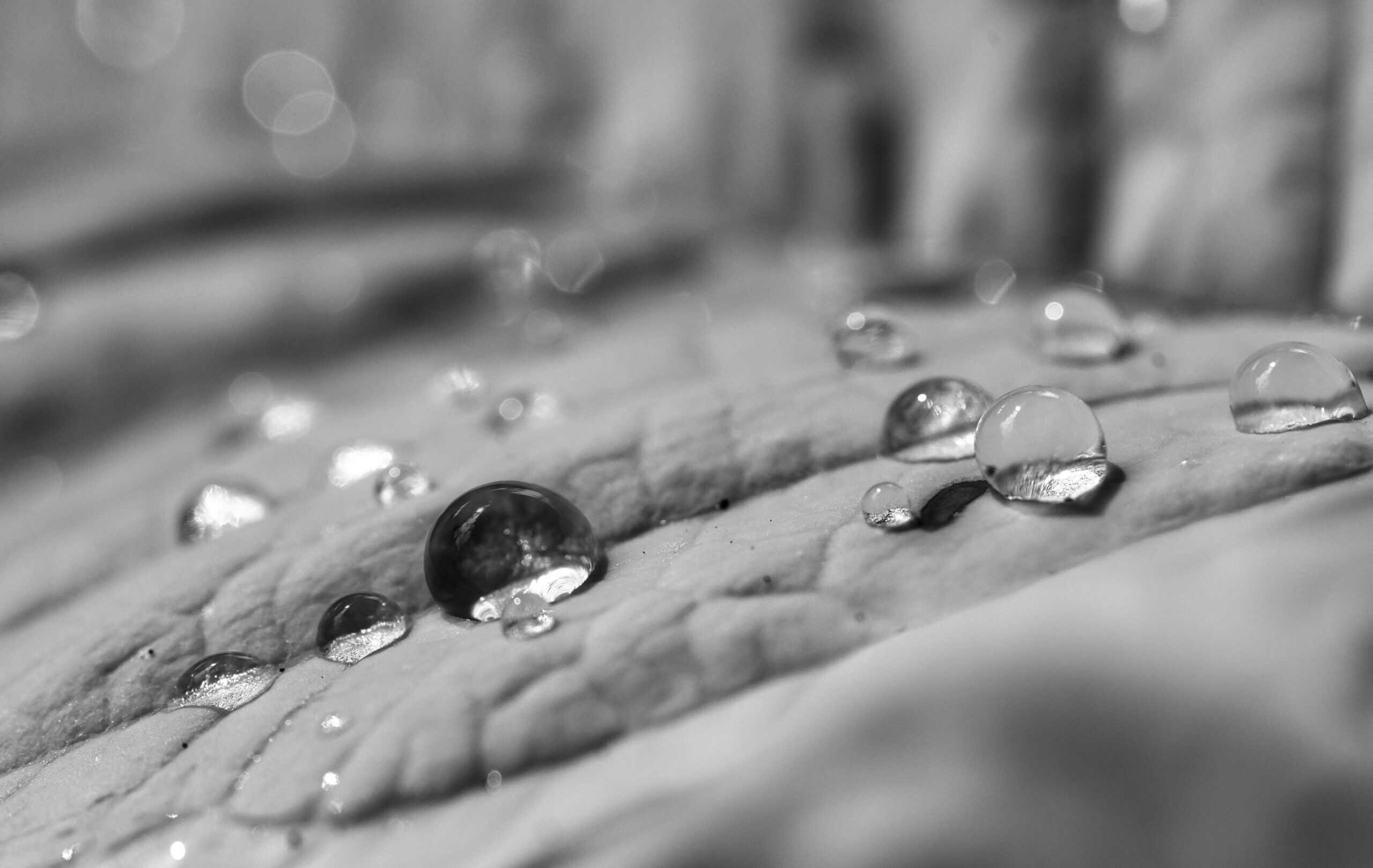 Water droplets on a grey fabric cloth