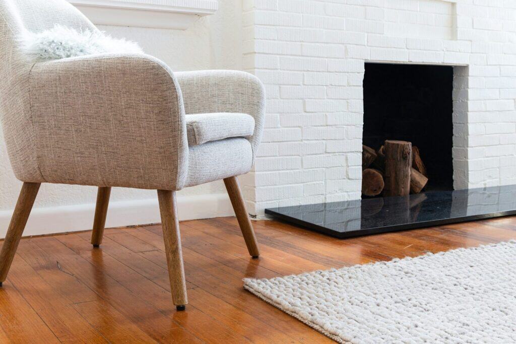 White chair near fireplace