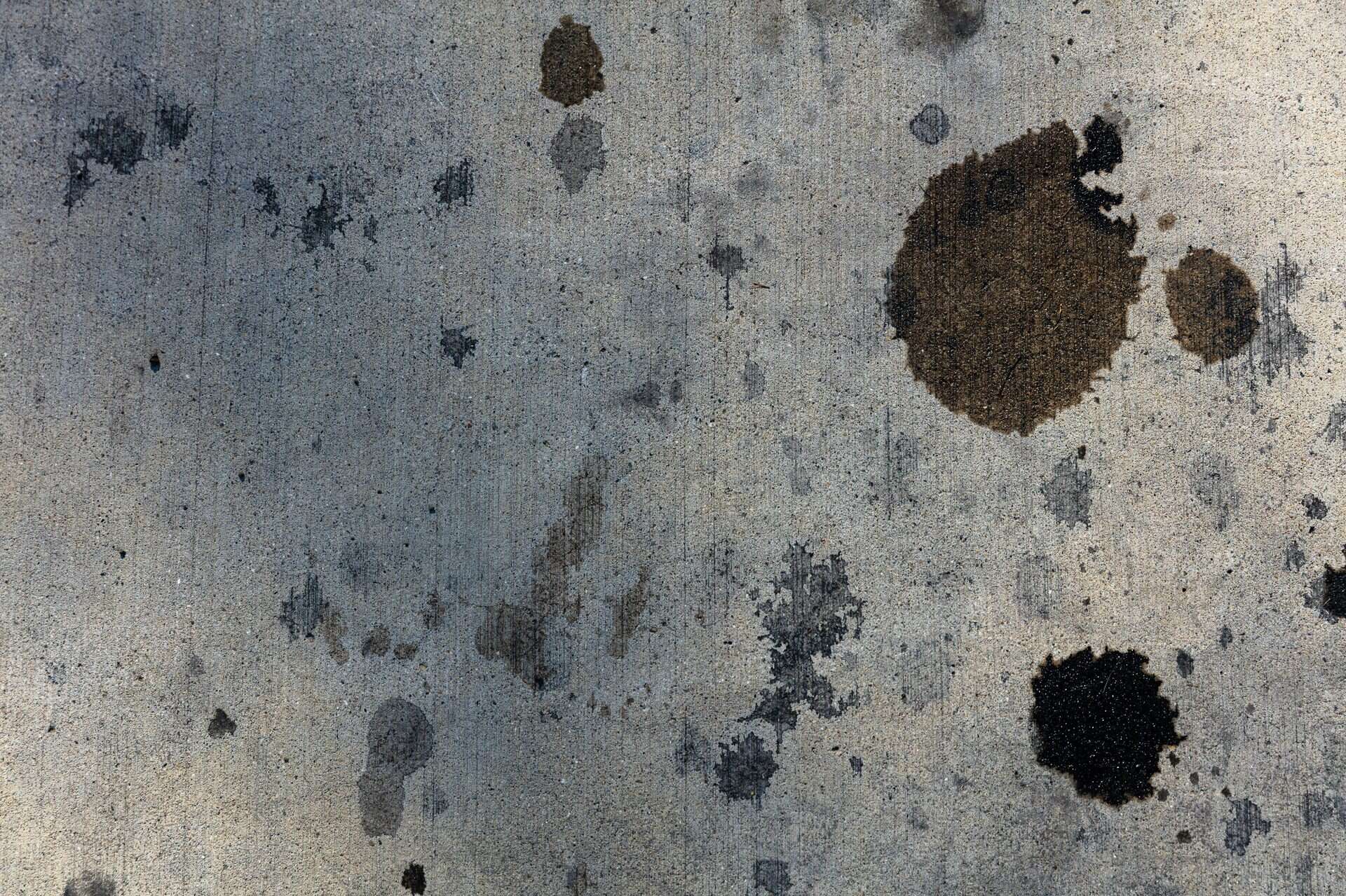 "Close-up of a carpet with a removable spot on one side and a permanent stain on the other."